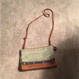 All leather cross body in mint green and tobacco brown
